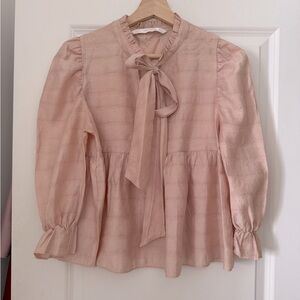 Zara blouse with round neck and self tie.